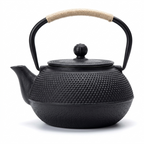 Hobnail cast iron teapot in matte black with a natural cord-wrapped handle, front view