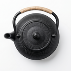 Hobnail cast iron teapot seen from above, showing the lid and its round knob