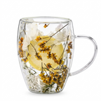 Double-wall glass cup with a handle, filled with real dried yellow and white flowers and a dried lemon slice between the walls