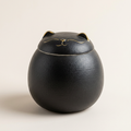 Black lucky cat tea caddy with a matte textured glaze