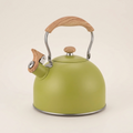 Green Vintage Whistling Kettle with a wood-effect handle, on a warm beige background